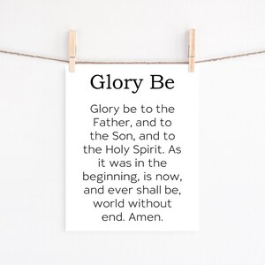 May include: A printable wall art design with the text "Glory Be" and the traditional Christian prayer "Glory be to the Father, and to the Son, and to the Holy Spirit. As it was in the beginning, is now, and ever shall be, world without end. Amen."