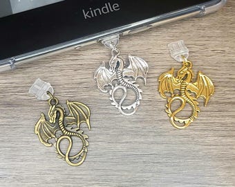 May include: Three silver dragon book marks with clear plastic clips. The dragons are in different poses with wings spread. The dragons are attached to the clips with a silver ring.