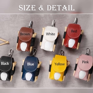 May include: Golf ball holder in various colors: brown, white, red, black, blue, yellow, and pink. Each holder has a golf ball and tees. The text "SIZE & DETAIL" is at the top.