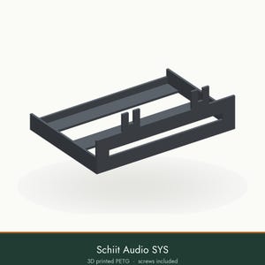 May include: A dark gray 3D printed PETG mounting bracket for Schiit Audio SYS equipment. The rectangular frame features a flat base with integrated vertical tabs for secure attachment, and the product includes necessary mounting screws.