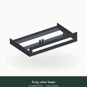 May include: A dark gray 3D printed PETG stand for a Korg volca beats synthesizer. The rectangular frame features two vertical mounting tabs on the rear crossbar and open side panels, designed to hold the device securely. Screws are included.