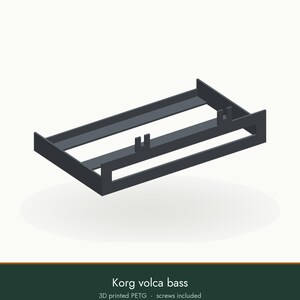 May include: A dark gray 3D printed PETG stand for a Korg volca bass synthesizer. The rectangular frame features two vertical support tabs on the front crossbar and two on the back crossbar, designed to hold the device securely in place.