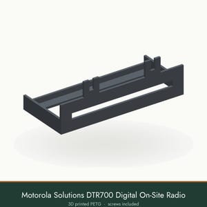 May include: A dark gray 3D printed PETG mounting bracket for a Motorola Solutions DTR700 digital on-site radio. The rectangular frame features two vertical tabs on the top edge and a horizontal cutout along the front face. Screws are included.