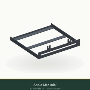 May include: A dark gray 3D printed PETG mounting bracket for an Apple Mac mini, featuring a rectangular frame with integrated side rails and two small vertical tabs on the front edge. The text Apple Mac mini 3D printed PETG screws included is visible.