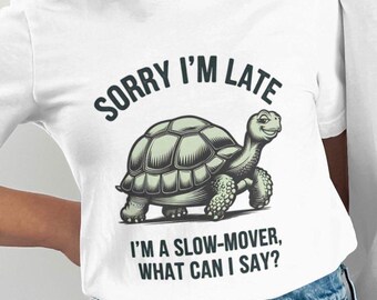 May include: White t-shirt with a green turtle illustration and the text "Sorry I'm late, I'm a slow-mover, what can I say?"