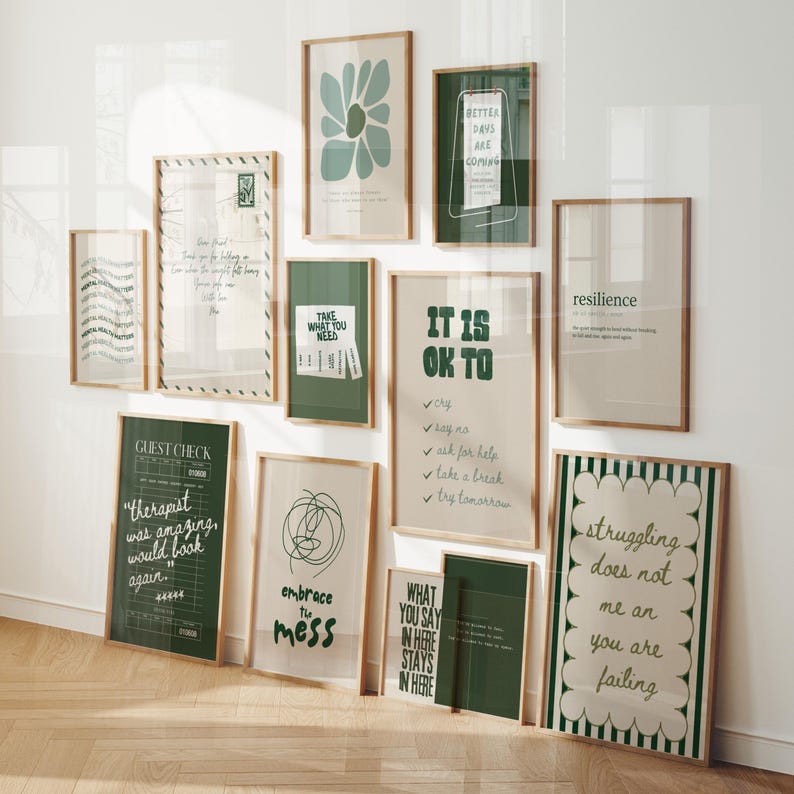 May include: A collection of framed art prints with inspirational quotes and abstract designs. The color palette includes shades of green, beige, and white. The frames are made of light-colored wood. The prints feature phrases like "Better Days Are Coming" and "It Is Ok To".
