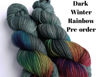 Hand dyed yarn pre-order.  Dark Winter Rainbow colourway. Variegated wool yarn dyed to order. Dark green/grey with dark rainbow.