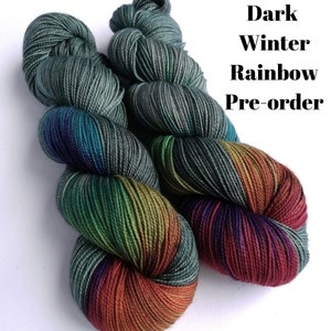 Hand dyed yarn pre-order.  Dark Winter Rainbow colourway. Variegated wool yarn dyed to order. Dark green/grey with dark rainbow.