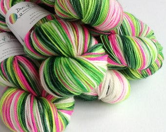 Hand dyed yarn pre-order.  Whoville colourway, variegated wool yarn. Dyed to order. Christmas yarn, you choose base.  Pink and greens