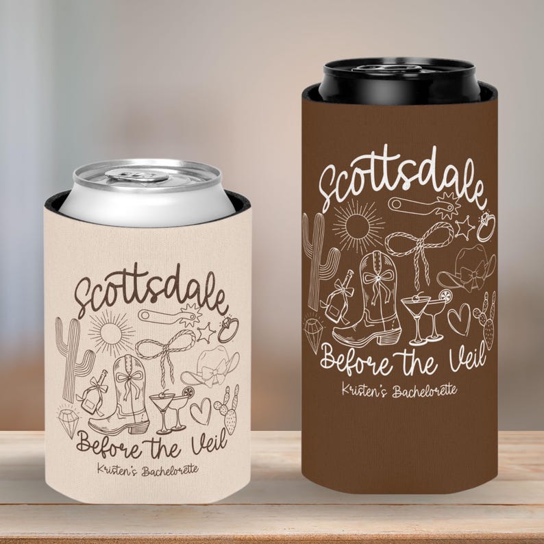 May include: Two can coolers with a Scottsdale, Arizona theme. One is tan, the other is brown. Both have white line art of cowboy boots, a hat, cactus, and the text "Scottsdale Before the Veil".