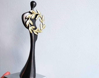 Figure with laurel wreath, solid brass figurine of minimalist aesthetic, oxidised brass figure sculpture with wreath on aluminum base