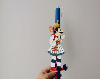 Greek easter candle with barbayiorgos puppet, royal blue easter candle with a greek karagiozi marionette, barbayiorgos greek lambada