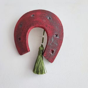 Red ceramic horseshoe, life size horseshoe in red, handbuilt horseshoe art object