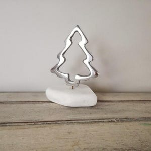 Christmas tree outline, aluminum tree sculpture on white stone, holiday decor silver christmas tree, minimalist xmas tree figurine