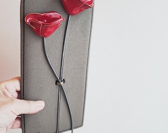 Red poppies wall decor, red poppies on grey tile, minimalist ceramic poppies with iron stems on rectanglular, grey, ceramic wall tile