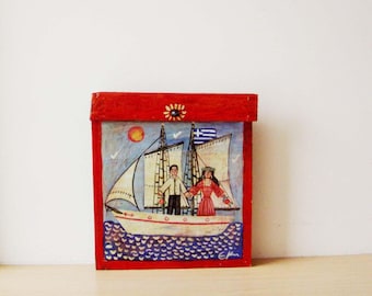 Pintura popular de hombre y mujer, pintura popular antigua de pareja en un velero, pintura popular sobre madera recuperada, boda popular griega