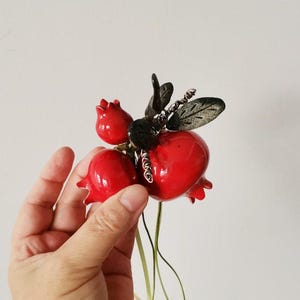 Ceramic pomegranates bouquet, red glaze pomegranates with green leaves, brass wire bouquet of three pomegranates
