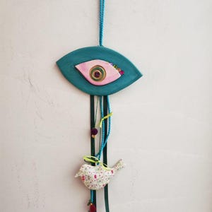 Occhio blu in ceramica, arazzo da parete con occhio blu e rosa con figura di uccello, nastri e perline, occhio portafortuna, regalo di inaugurazione della casa