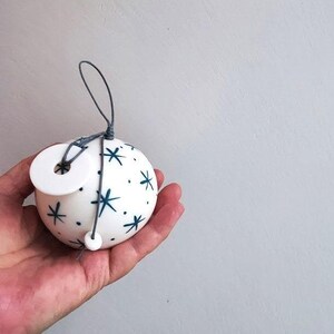 Porcelain christmas ball, ornament in white with blue stars and 2024 charm, white christmas bauble with 2024 charm