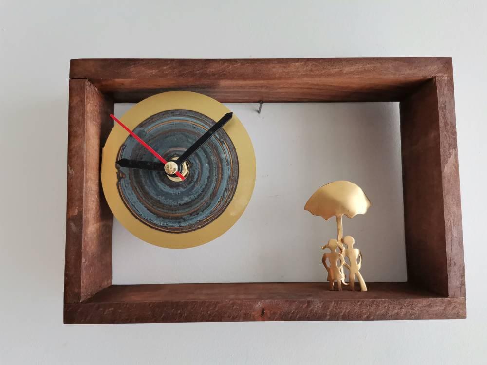 Couple with umbrella clock, brass, gold plated figures with umbrella clock, wooden frame brass dial brass sculpture clock
