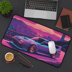 May include: A purple and blue car with a sunset cityscape background. The car is driving on a winding road. The mousepad is designed for use with a computer.