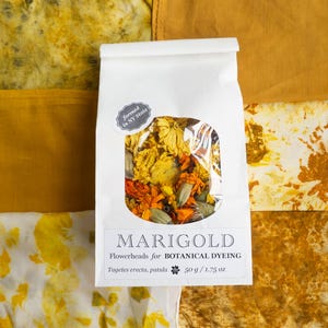 May include: A white paper bag containing dried marigold flowerheads for botanical dyeing, labeled with the text MARIGOLD Flowerheads for BOTANICAL DYEING Tagetes erecta, patula 50 g / 1.75 oz and a sticker stating farmed in NY State.