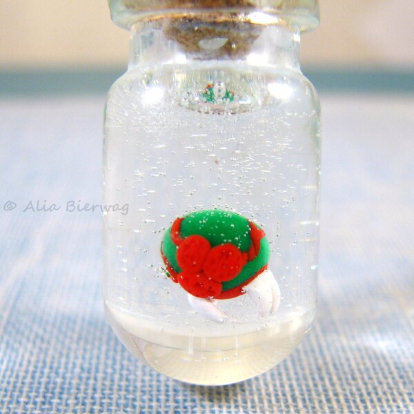 Metroid inspired pet alien larva. Glass bottle charm. The original. Necklace, keychain, phone charm.