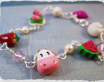 Harvest Moon inspired polymer clay charm bracelet. Girly gamer jewelry. Pink, red.