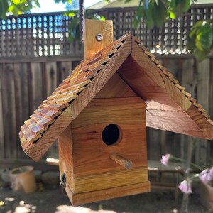 Beautiful custom made and handcrafted unique birdhouses made of rot-resistant redwood for your garden, patio or gift.