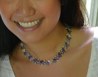 a meticulously created choker of czech rectangular and seed beads
