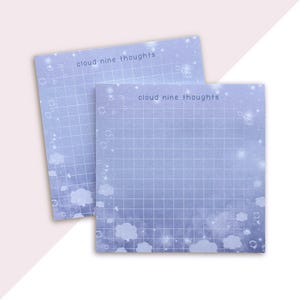 May include: Two blue notepads with a grid pattern and a cloud and star design. The notepads have the text "cloud nine thoughts" printed on them.