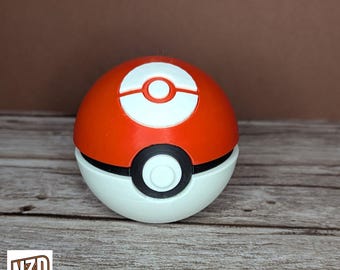 May include: A red and white Poke Ball with a black ring around the middle. The Poke Ball is a popular toy and collectible from the Pokemon franchise.