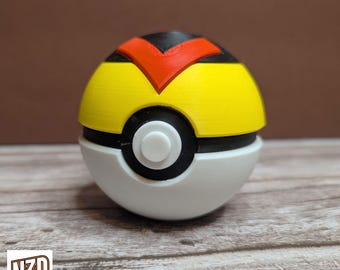 May include: A 3D printed Poke Ball with a red and black V-shaped design on the top half. The bottom half is white with a black ring and a white button in the center.