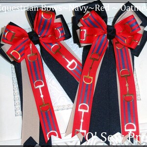 May include: Two navy, red, and oatmeal equestrian bows with gold snaffle bit accents. The bows are tied together with a single knot in the center.