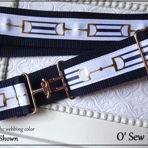May include: A navy blue and white striped webbing strap with gold horse bit accents and a gold metal buckle. You choose the webbing color, Navy Shown. O' Sew Pretty.