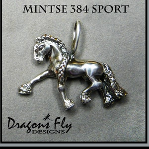 May include: Silver horse pendant charm with a braided mane and tail. The charm is in a standing pose with one leg raised. The charm is labeled "Mintse 384 Sport" and "Dragon's Fly Designs".