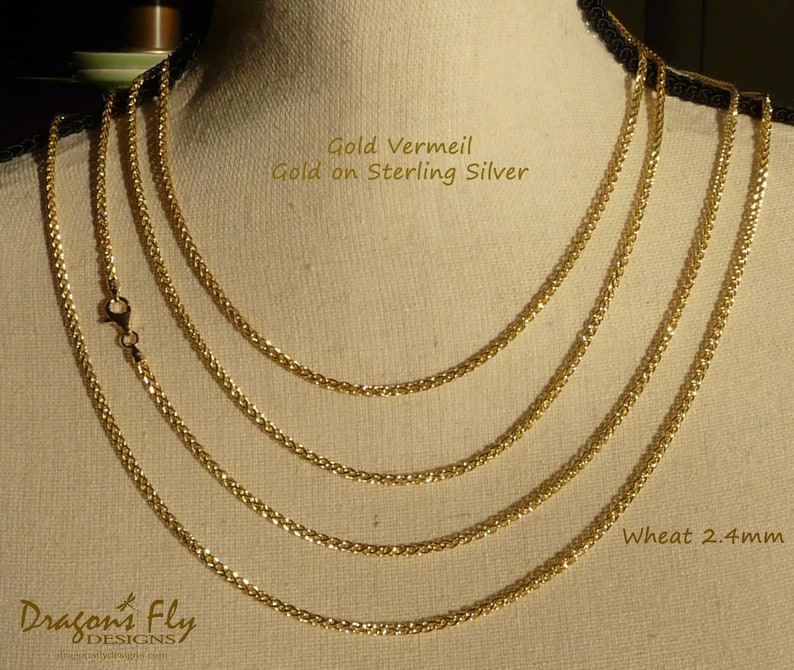 May include: Four gold vermeil wheat chains on a mannequin, with the text "Gold Vermeil Gold on Sterling Silver" and "Wheat 2.4mm".