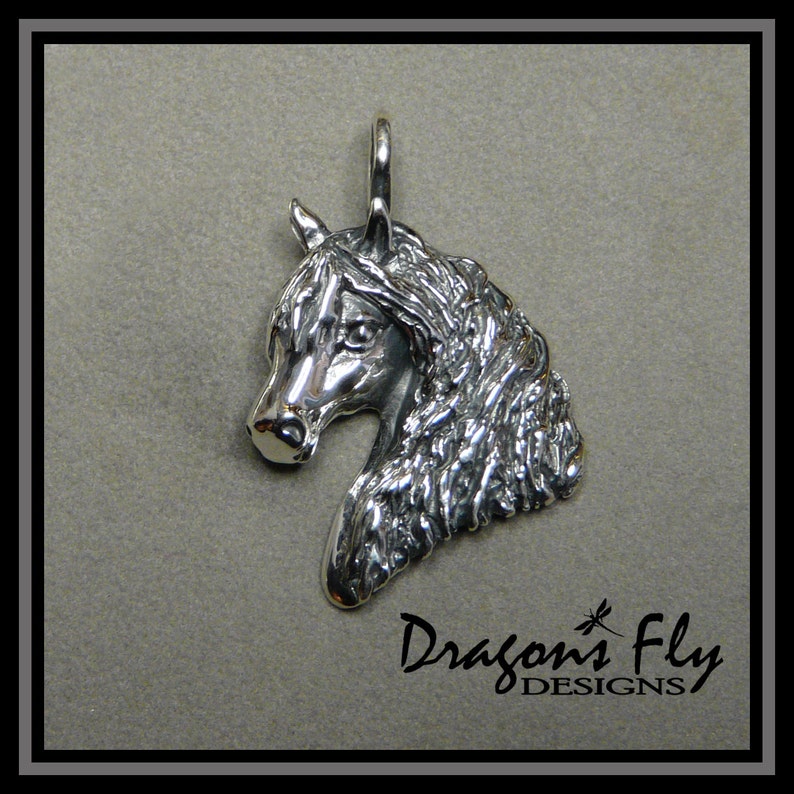 May include: Silver pendant charm featuring a detailed sculpted horse head with a flowing mane. The pendant is a three-dimensional design and is suitable for jewelry making.