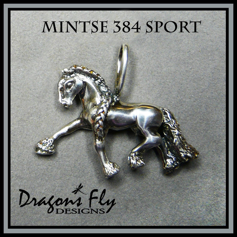 May include: Silver horse pendant charm with a braided mane and tail. The charm is in a standing pose with one leg raised. The charm is labeled "Mintse 384 Sport" and "Dragon's Fly Designs".