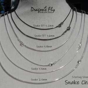 May include: A close-up of six silver snake chains of different thicknesses, displayed on a mannequin. The chains are labelled with their respective sizes in millimetres: 1.2mm, 1.6mm, 1.9mm, 1.5mm, and 2.5mm. The text "Sterling Silver Snake Chain" is also visible at the bottom of the image.