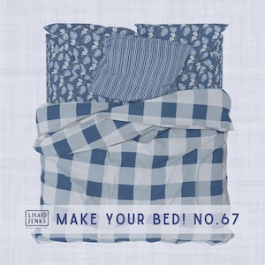 May include: A bed with a blue and white checkered duvet cover, a striped pillow, and two pillows with a blue leaf pattern. The text "MAKE YOUR BED! NO.67" is visible.