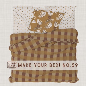 May include: Overhead view of a made bed with a brown and tan plaid comforter. The bed has a white sheet with brown polka dots and a brown pillow with a leaf pattern. The text "MAKE YOUR BED! NO.59" is visible.