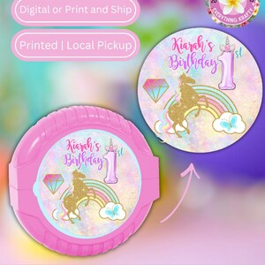 May include: Pink bubble gum container and label with a unicorn theme. The label features a gold unicorn, rainbow, diamond, and the text "Kiarah's Birthday 1st". The image also includes text that says "Unicorn Bubble Gum Labels".