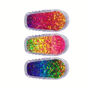 May include: Three clear plastic insulin pump covers with a rainbow glitter design. The top cover is red, orange, and yellow. The middle cover is yellow, green, and pink. The bottom cover is blue, green, and purple.