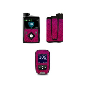 May include: A pink and black patterned skin for a blood glucose meter. The meter displays a reading of 120 mg/dL and 0.5 U of insulin. The skin also includes a matching case for the meter.
