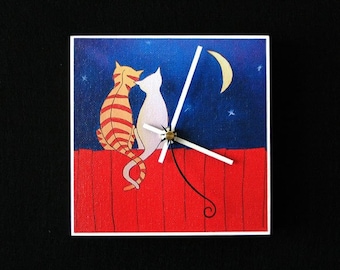 Night cats on a fence, art clock