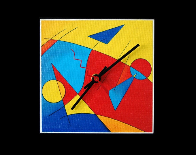 Fun, abstract art clock with intense yellows, reds and blues