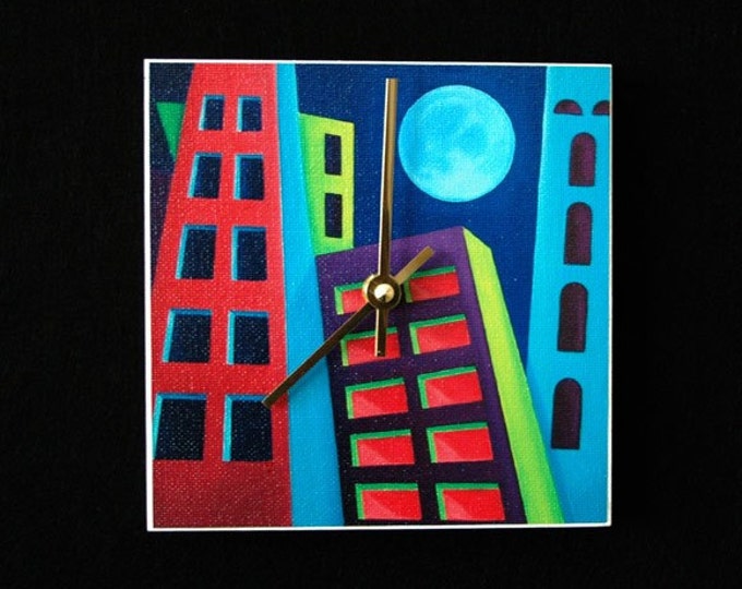 Night time cityscape with full moon in blue, green and purple, art clock