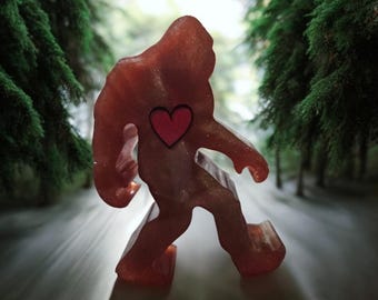 Brown resin Bigfoot statue/ paperweight with red heart