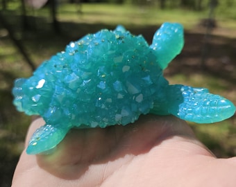 Bluish green resin crystal sea turtle with gold glitter